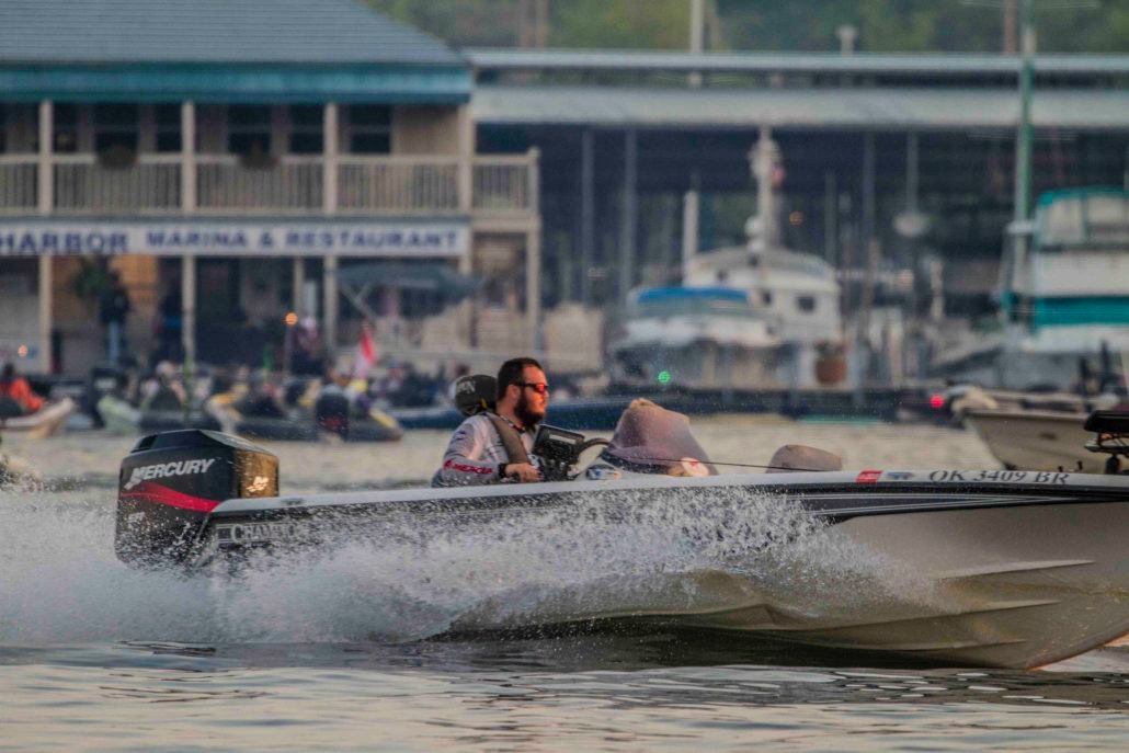 Bass boat running past the harbor marina at a tournament