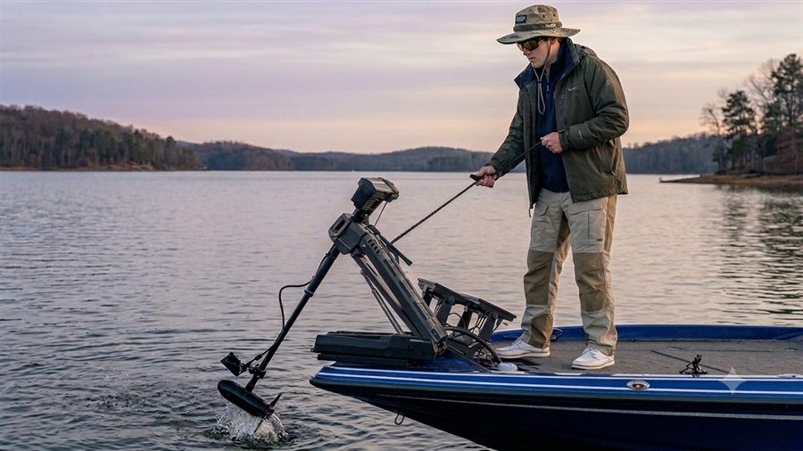 Angler deploying a bow-mount trolling motor at dawn