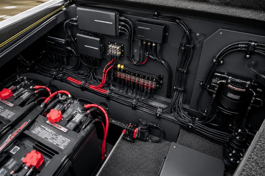 Custom marine wiring harness and fuse block installed under a boat console